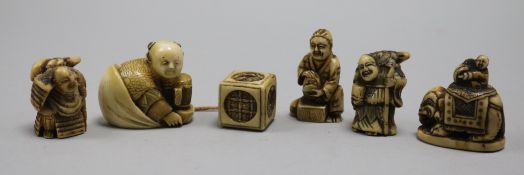 Five Japanese netsuke, one signed, and a cube toggle