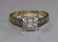 A 1920's style 18ct gold, platinum and diamond set dress ring, size L.