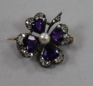 A Victorian gold, amethyst, pearl and diamond set brooch modelled as a purple four leaf clover,