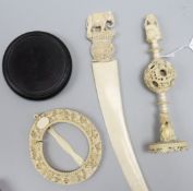 A Chinese carved ivory puzzle ball, an Indian ivory paper knife with elephant finial and a Canton