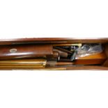A mahogany rectangular box containing rulers, draughts, horn-handled penknives, etc.