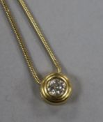 An 18ct gold and solitaire diamond pendant, on a 9ct gold fine snake link chain, 42cm.