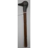 A Victorian walking cane with silver ducks head