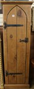 A narrow tall pine cupboard, W.61cm