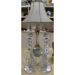 A cut glass, table lamp and set of four candlesticks