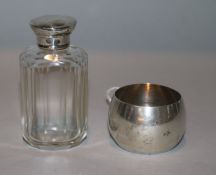A Victorian silver tumbler cup by Hukin & Heath, London, 1883 and a silver mounted toilet bottle.
