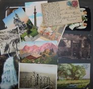 A quantity of mixed postcards and an album