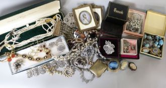 A quantity of costume jewellery, including marcasite, paste, a pair of miniatures etc in 2 boxes.