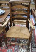 A set of 6 late 19th century ladderback chairs with rush seats