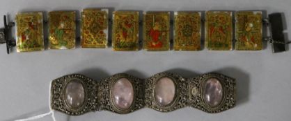 An Indian metal and rose quartz bracelet and a painted mother of pearl bracelet.