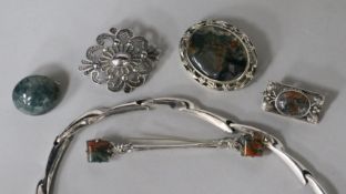 Two silver and moss agate brooches, three other brooches and a stylish silver necklace.