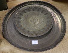 Three Islamic brass dishes, Largest W.55cm