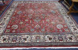 A Tabriz style red ground carpet 10ft x 4ft 6in.