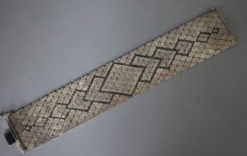 A 1970's textured silver bracelet, 19.5cm.