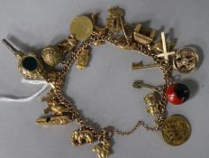 A 9ct gold chain-link charm bracelet set with various 9ct gold charms, a half sovereign, a fob