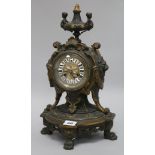 A bronze French mantel clock, 14in.