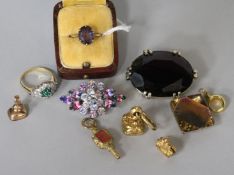 A 9ct gold and amethyst ring, a fob seal watch key, two watch fob seals and sundries, including a