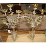 A pair of French gilt metal gothic style candelabra, 22in.