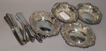 Two pairs of late Victorian pierced silver bonbon dishes and two sets of six cake knives.