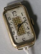 A lady's 9ct gold rectangular manual wind wrist watch (no strap).