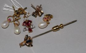 A 14ct yellow gold, ruby and diamond pendant, a yellow metal insect stick pin, a ruby and pearl