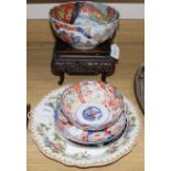 A Chinese carved hardwood stand, two Imari bowls and a similar dish and two other items, a modern