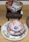 A Chinese carved hardwood stand, two Imari bowls and a similar dish and two other items, a modern