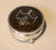 A George V silver and tortoiseshell pique circular trinket box, by Goldsmiths & Silversmiths,