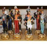 A set of seven Capo di Monte style figures of Officers of British Regiments, tallest 32cm, and a