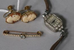 A pair of 9ct gold and cameo ear clips, a cocktail watch and a bar brooch.