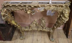 A 19th century Continental giltwood and gesso console table, lacks marble top, W.4ft 7in.