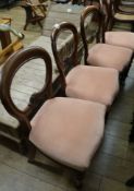 A set of four Victorian mahogany balloon back dining chairs