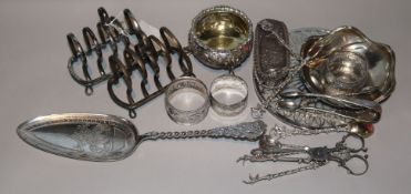 A pair of George V silver toast racks, three silver napkin rings and fourteen other assorted