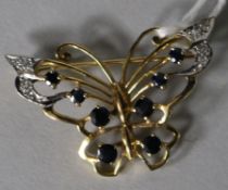 A modern 9ct gold, sapphire and diamond set butterfly brooch, 35mm.