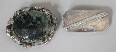 A Victorian silver-framed moss agate brooch and an engraved silver brooch