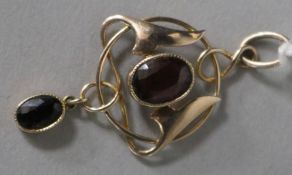 An Art Nouveau Murrle Bennett & Co 9ct gold and garnet set pendant, overall 39mm.