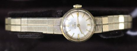 A ladys 1960's 9ct gold Cyma manual wind wrist watch, with original receipt and box.