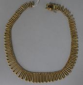 A 9ct gold fringe necklace (clasp detached), 40.5cm.