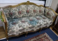 A carved giltwood three piece suite settee 6ft 6in.