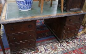 An Anglo Indian padouk pedestal desk 5ft 3in x 3ft 8in.