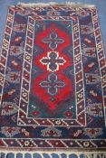 A Turkistan red ground rug, 6ft x 4ft 1in.