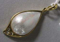 An 18ct gold, mabe baroque pearl and diamond set pendant, 28mm.