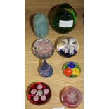 A collection of eight paperweights