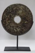 A large Chinese stone bi disc with stand, Dia.30cm not including stand