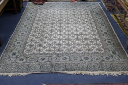 A Bokhara style cream ground carpet, 11ft 6in. x 8ft 5in.