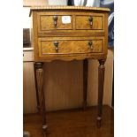 A small burrwood bowfronted bedside chest, of three drawers, W.1ft 5in.