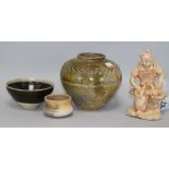 A Chinese green glazed jar, two other pottery jars and a pottery figure