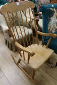 A beech spindle back rocking chair