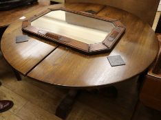 An oak single pedestal extending dining table, and a 1930's oak wall mirror, table W.3ft 10in.