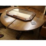 An oak single pedestal extending dining table, and a 1930's oak wall mirror, table W.3ft 10in.